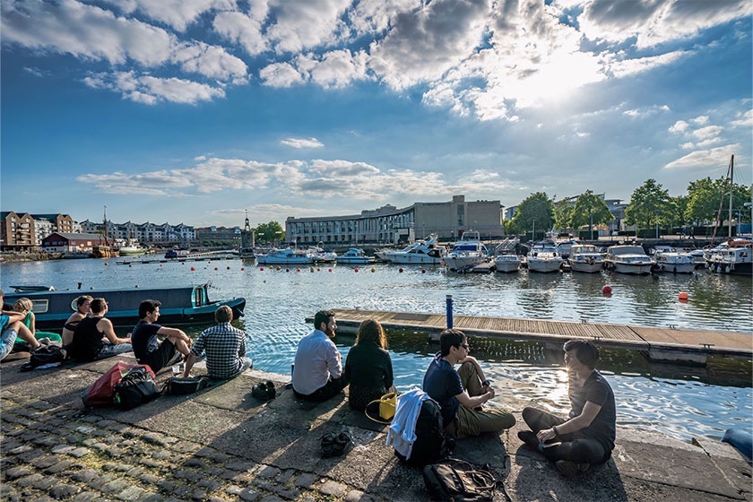 People sitting on the quay in Bristol