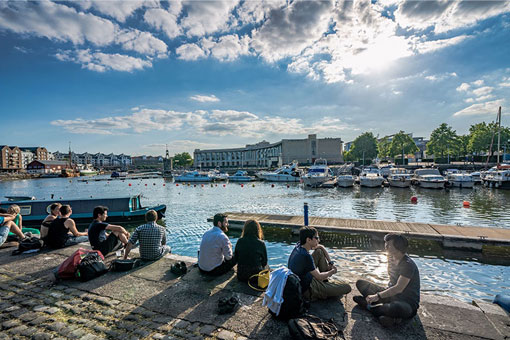 People sitting on the quay in Bristol