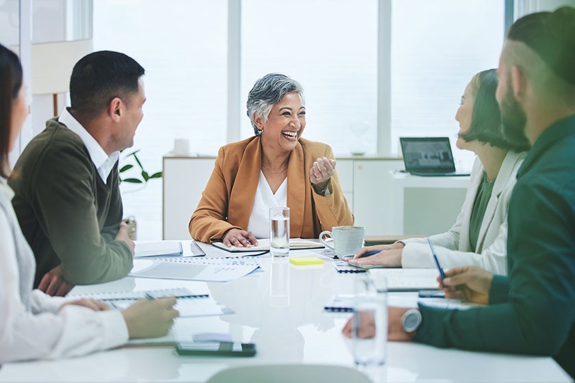 Older women holding board meeting